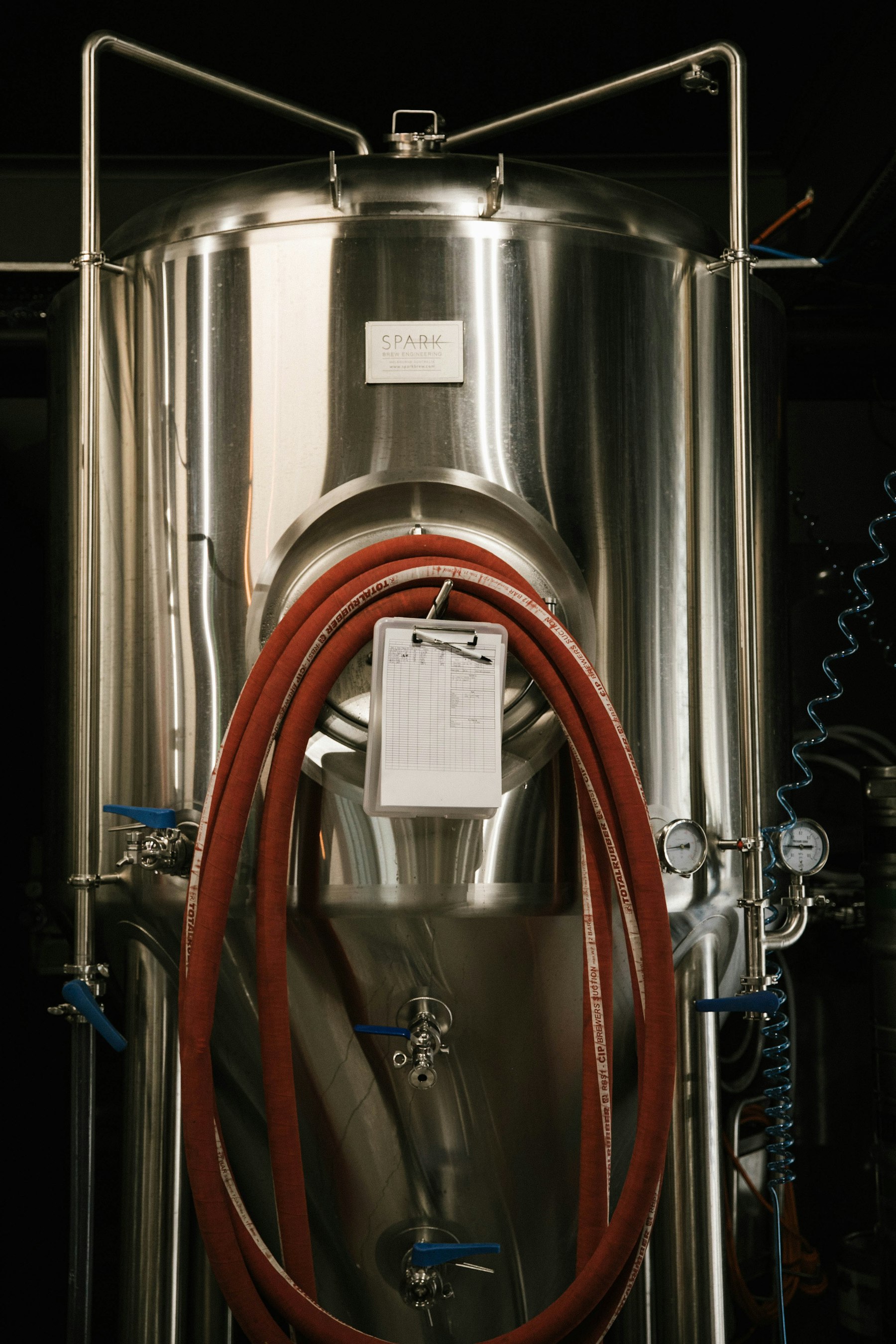 Stainless steel fermentation tanks inside the Commons and Crown brewhouse in London Ontario