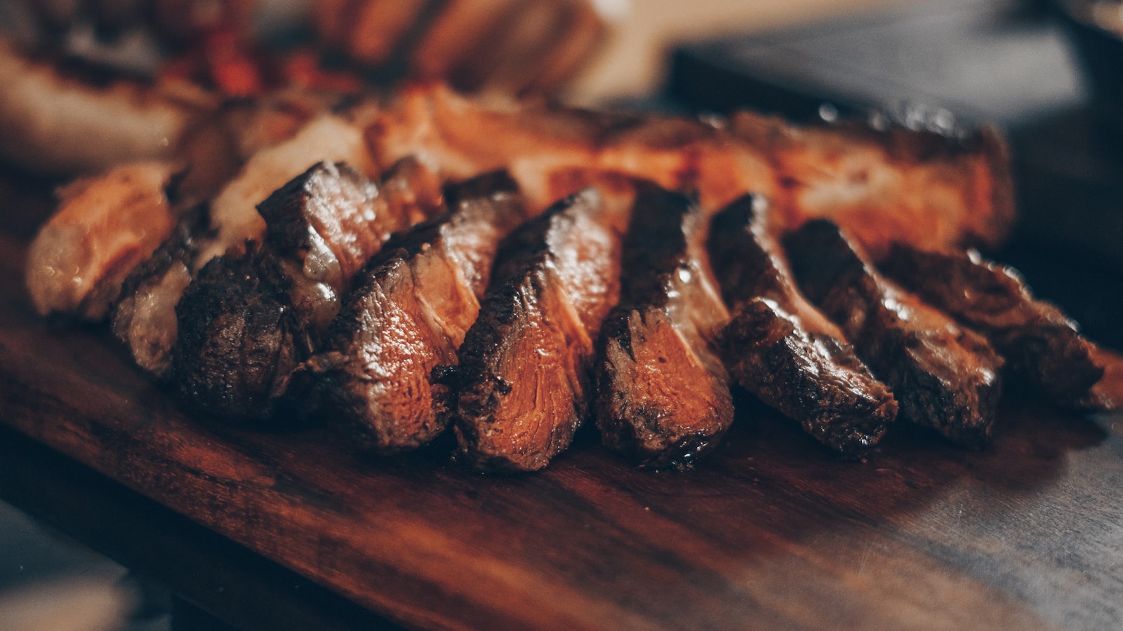 Steak over open flame in the kitchen at The Tallow Room